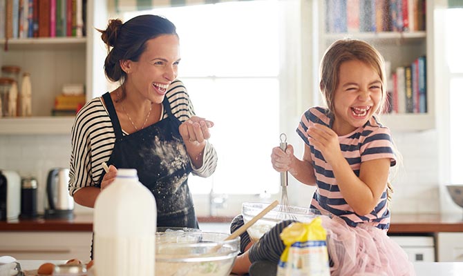 Mom and daughter baking in the kitchen